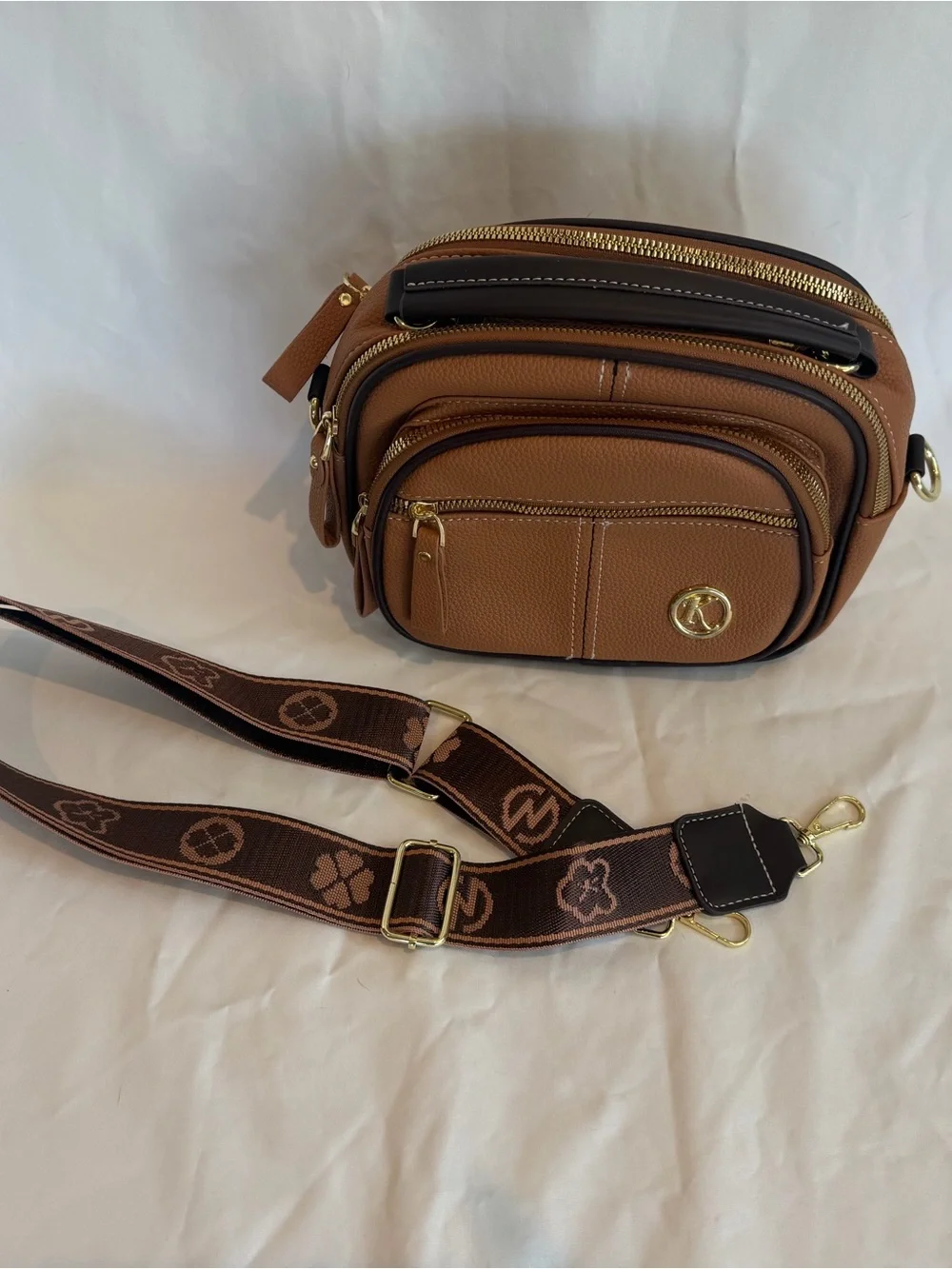 K-Emblem Tan Pebbled Leather Crossbody Bag with Patterned Strap